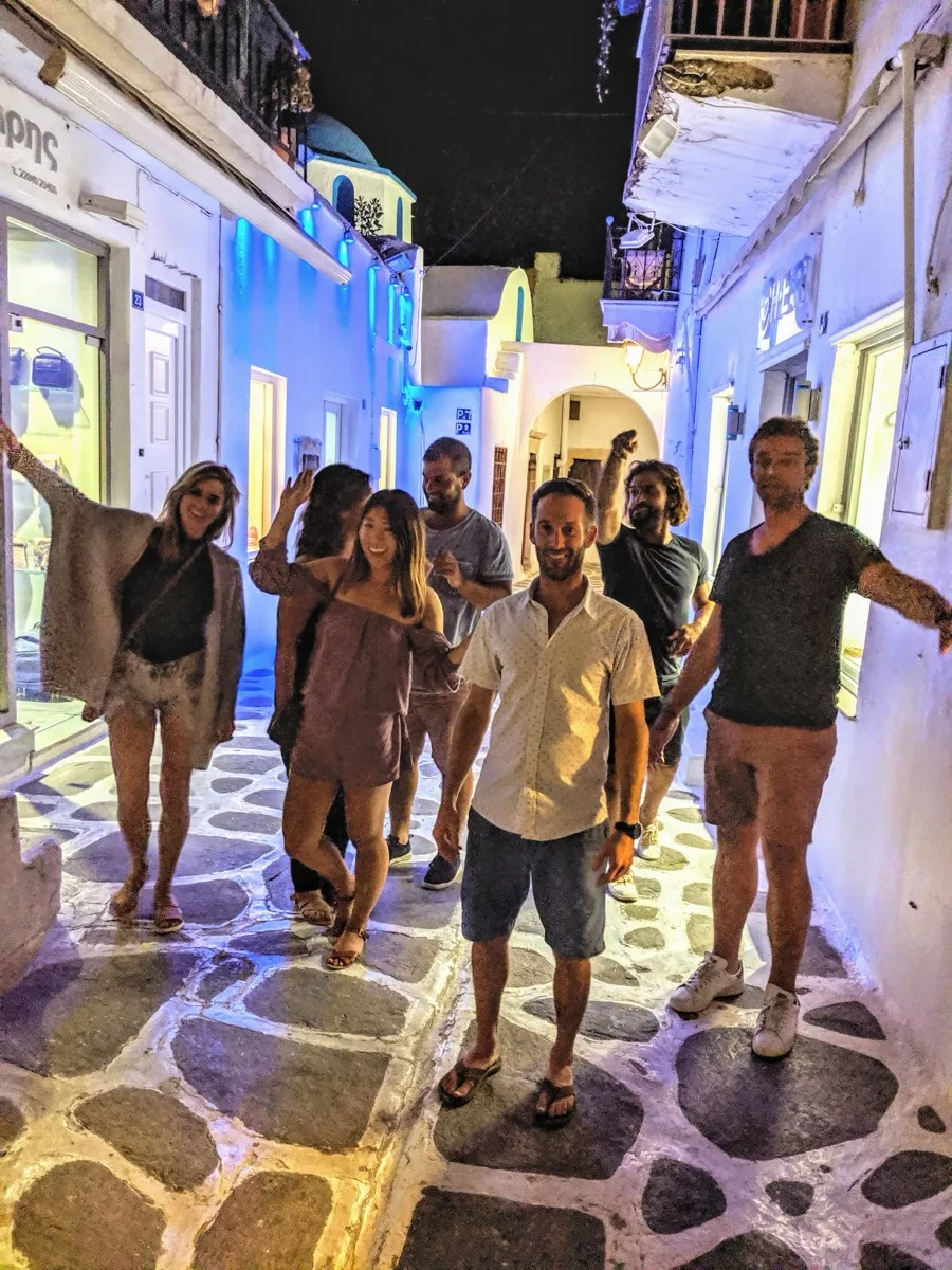 A Cycladic village glowing at night, a typical evening stop ashore.