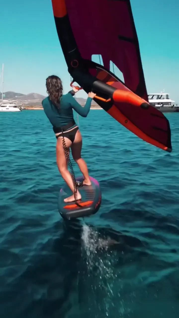 Kitesurfer riding flat water in the Greek Cyclades.